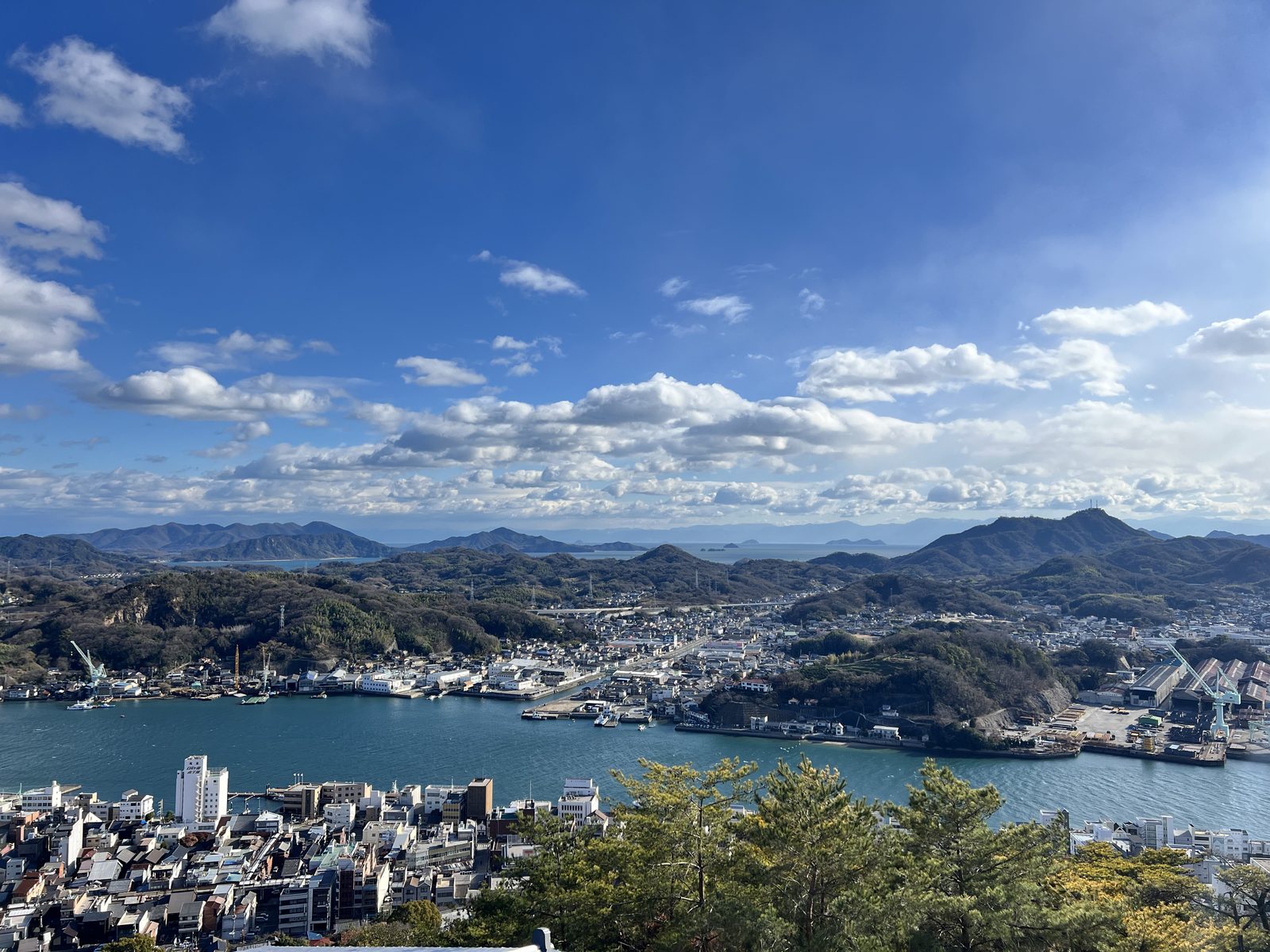 A view of the sea and hills in Onomichi on a sunny day
